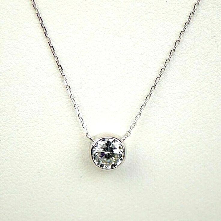 ✅ Stone Specifications: 💎 Type: Simulated/Created Diamond AAA 💎 Cut: Round Cut 💎 Color: White D 💎 Clarity: VVS 💎 Example Size Carat Weight: 1.00 Ct Aprox.. 6MM Stone 💠 Necklace Specifications: ⭐ Metal: Real White Gold Solid ⭐ Purity: 14K .585 Europe ⭐ Setting Style: Bezel | solid ⭐ Chaine Size: 16" extension adjustable to 18''. ⭐ Stamped: 14K 🔹 Free Shipping. 🔹 Comes With Free Gift Box. 🔹 We guarantee that our product is Real 14K Solid Gold. Formal Birthstone Pendant Necklace With Bezel Setting, Classic Necklaces With Round Pendant And Bail, Classic Bezel Set Pendant Birthstone Necklace, Gift Solitaire Necklace With Bezel Setting And Round Stone, Gift Solitaire Necklace With Round Bezel Setting, Solitaire Necklace With Bezel Setting For Gift, Classic Birthstone Pendant Necklace With Bezel Setting, Round Diamond Necklace With Bail, Classic Pendant Birthstone Necklace With Bezel Setting