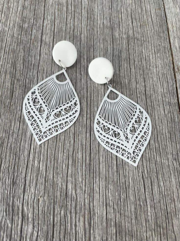 Stand out from the crowd in these fabulous statement earrings. They have been handmade using hand rolled polymer clay studs, surgical steel posts and backs and a filigree statement drop.  The clay studs are approx 19mm in diameter and the drop is approx 59mm in length. They are fun, light and comfortable to wear. Unique White Pierced Earrings, Adjustable Nickel-free White Teardrop Earrings, Unique White Polymer Clay Earrings, White Laser Cut Earrings As A Gift, White Laser Cut Earrings For Gift, Unique White Plug Earrings, Unique White Hypoallergenic Earrings, Unique Hypoallergenic White Earrings, White Laser-cut Jewelry For Gifts