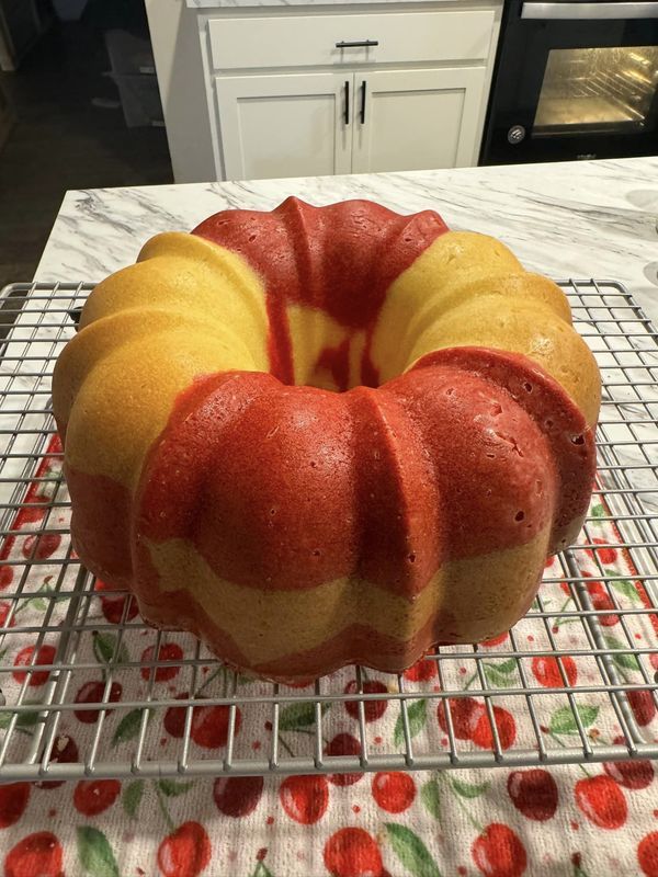 a bundt cake sitting on top of a cooling rack