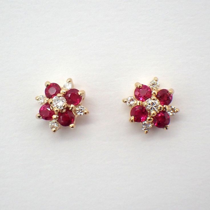 Vintage 14k (.585) yellow gold stud earrings, decorated with Pink Sapphire stones and Diamonds.  The Rubies are heat treated, measuring 2.5 mm in diameter, Diamonds are 0.1ctw, SI clarity, color I-J. These gorgeous earrings are 9 mm in diameter, weighing a total 2.3 grams. EA3293 Red Cluster Earrings For Anniversary, Red Fine Jewelry Cluster Earrings For Anniversary, Pink Ruby Earrings For Anniversary, Pink Diamond Earrings Studs, 2 Grams Gold Earrings Designs, Red Cluster Earrings For Anniversary, Fine Jewelry, Fine Jewelry Pink Sapphire Earrings In Yellow Gold, Elegant Pink Gold Pink Sapphire Earrings, Pink Sapphire Earrings Studs