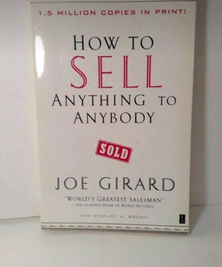 the book how to sell anything to anybody by joe girardd is on display