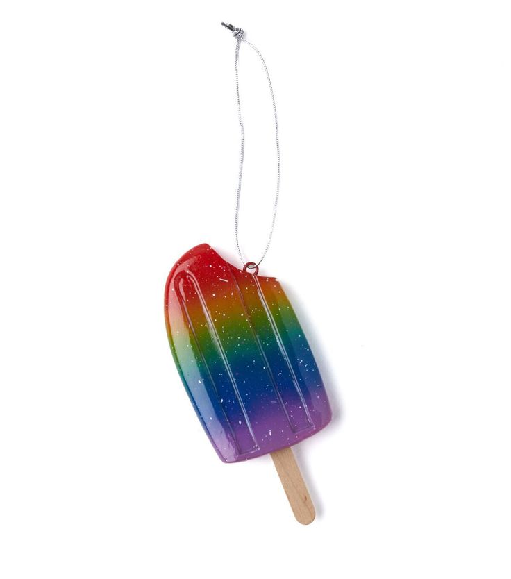 a popsicle shaped ornament hanging from a string on a white background,