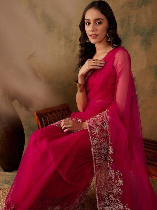 Magenta net sareeFloral embroidered saree with embroidered borderHas zari detailThe saree comes with an unstitched blouse pieceThe blouse worn by the model might be for modelling purpose only. Check the image of the blouse piece to understand how the actual blouse piece looks like. Semi-stitched Pre-draped Saree With Sheer Dupatta For Diwali, Eid Anarkali Pre-draped Saree With Pallu, Bollywood Style Semi-stitched Saree With Sheer Dupatta, Bollywood Style Art Silk Pre-draped Saree With Sheer Dupatta, Semi-stitched Saree With Sheer Dupatta For Festive Occasions, Festive Net Pre-draped Saree In Traditional Drape, Anarkali Net Blouse Piece For Eid, Festive Net Pre-draped Saree With Traditional Drape, Festive Net Pre-draped Saree In Traditional Shape