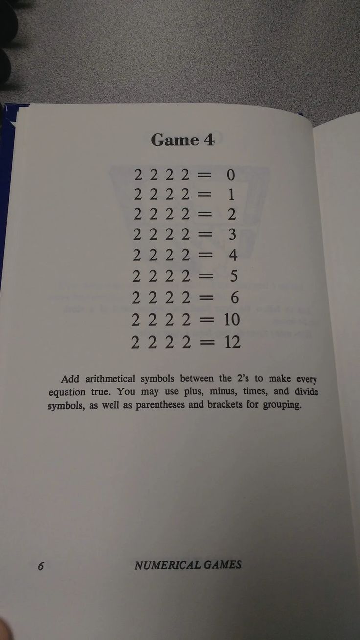 an open book with numbers and symbols on it