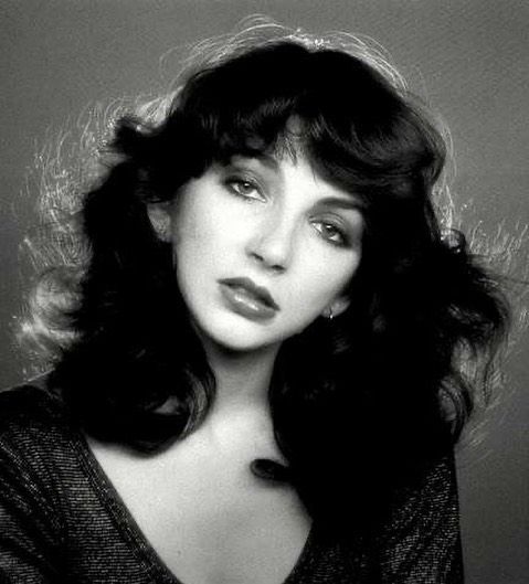 a black and white photo of a woman with long hair