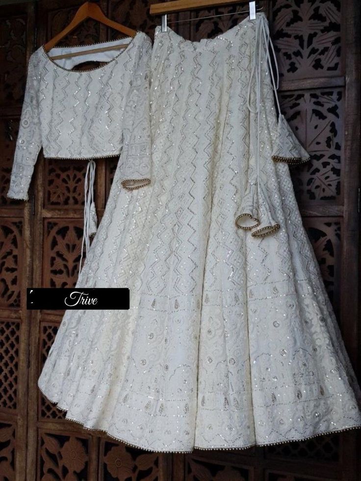 Made to Order/Measurement/Custom Order Lehenga - Color :  white - Fabric : Embroidered  Georgette - Fully flared paneled lehenga - Embroidered  Blouse -  Net Dupatta with Gold Border - Drawstring closure with Tassels - - It can be customize in any design or size  PLEASE NOTE: BUYERS ARE RESPONSIBLE FOR ANY CUSTOMS AND IMPORT TAXES THAT MAY APPLY. This is a made to order product. If you opt for 'Made To Measurement Option', we will provide a measurement template and you can share the measurements Luxury Off White Chikankari Embroidered Choli, Luxury Off-white Chikankari Choli, Luxury Off-white Choli With Chikankari Embroidery, Indian White Bridesmaid Dresses, Traditional White Gown With Pallu, White Gown With Zari Work For Traditional Ceremonies, Festive Traditional White Gown, White Traditional Drape Gown For Ceremonies, White Gown With Resham Embroidery For Traditional Ceremonies