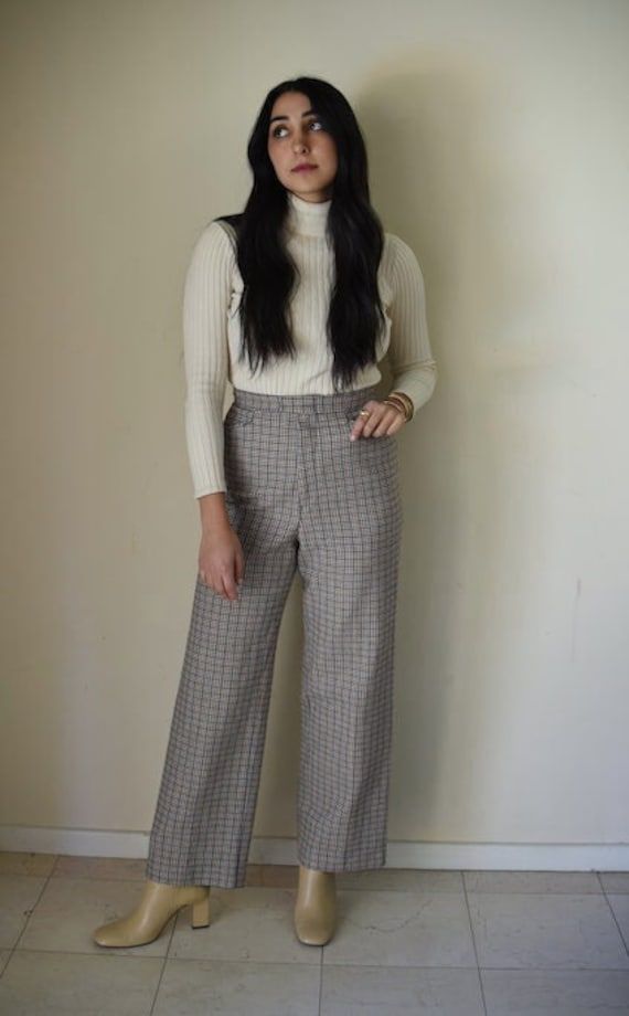 High Waisted Plaid/Gingham 70s Flare Trousers Brand: No brand listed, I believe these were handmade. Fabric: Unknown, a fabric similar to wool but less thick and not itchy. Condition: Great Size: no tag, Size small Length: 41' ( model's height is 5'4 for reference) Waist: 27' Gingham Cotton Pants For Fall, Cotton Gingham Pants For Fall, Vintage Wide Leg Pants For Winter, Retro Style Winter Workwear Pants, Fall Gingham Cotton Pants, Vintage Wool Pants For Fall, Vintage Winter Workwear Bottoms, Retro Plaid Pants For Fall, Retro Wool Bottoms For Fall