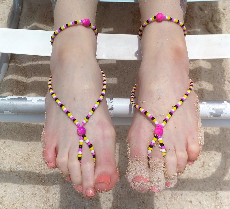 Beautiful hand beaded barefoot sandals. Wear them alone or with a pair of sandals. Made with glass beads on stretch cording. Anklets can be worn separately.  Perfect for any occasion, birthday gift, bridal party gift, or just because you care or love someone! Perfect for poolside, beach, yoga, weddings, festivals, and every walk of life between. You will receive 2 barefoot sandals and 2 matching anklets. ONLY 1 SET LEFT Adjustable Colorful Beaded Anklets For Summer, Adjustable Tiny Beads Anklets For Summer, Adjustable Tiny Beaded Anklets For Summer, Beaded Anklets With Round Beads For Summer, Summer Beach Anklets With Tiny Beads, Adjustable Beaded Barefoot Sandals For Party, Colorful Beaded Anklets For Beach Festival, Adjustable Anklets With Round Beads For Beach, Adjustable Round Beads Anklets For Beach