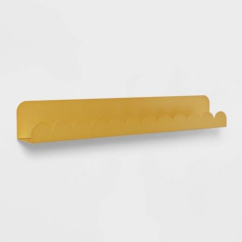 a yellow paper holder on a white wall