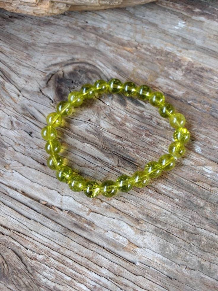 "PERIDOT  All natural, undyed and untreated semi-precious gemstones, please allow for natural variations.  bead size: 7-8mm  7.25\" stretchy elastic bracelet  Please check my other listings for other Chakra stretchy stone bracelets, you can special order stones, subject to cost and availability.  If you need more please contact me.  Peridot: emits a warm and friendly energy, heals a \"bruised\" ego, brings openness and acceptance in the intellectual pursuit of matters of love and relationships.  All jewelry will be shipped in a gift box or pouch at my discretion.    Please check out my other listings for more jewelry :)" Holistic Gemstone Beads Stretch Bracelet, Holistic Stretch Bracelet With Gemstone Beads, Hypoallergenic Holistic Beaded Bracelets, Hypoallergenic Stretch Bracelet For Meditation, Green 8mm Beads Stretch Bracelet For Meditation, Green Round Beads Stretch Bracelet For Meditation, Spiritual Stretch Bracelet With Hypoallergenic Round Beads, Tiffany Stone, Peridot Bracelet