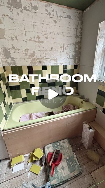 the bathroom is being remodeled with green and white tiles on the walls, floor, and bathtub