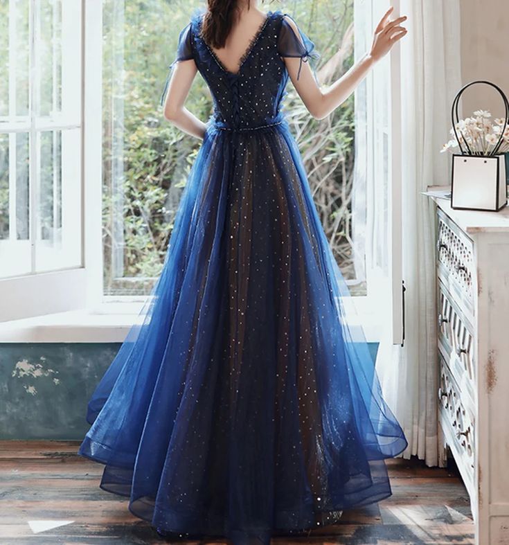 Material: Tulle Color:Navy Blue Hemline:Floor Length  Back Details:Lace-up Dress Number: #G2WS Delivery times: Processing time:    2-3 weeksShipping time:       3-5 working days Rush Order is available, for rush order, the processsing time is only 7-12 working days. Custom Measurements For custom size, please leave us Blue A-line Tulle Evening Dress, Blue A-line Dress For Prom, Fitted A-line Gown With Tulle Skirt, Fitted Blue Ball Gown With Tulle Skirt, Royal Blue Tulle Dress For Banquet, Blue Gown With Tulle Skirt And Fitted Bodice, Blue A-line Evening Dress For Banquet, Fitted Royal Blue Tulle Evening Dress, Blue Tulle Dress For Prom Season