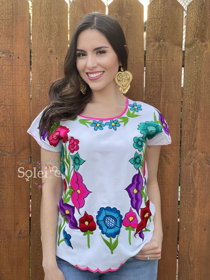 This Beautiful Mexican blouse is full of colorful flowers in both the front and the sleeves that are inspired by Mexican culture. This blouse is embroidered By Mexican Artisans in Chiapas and is completely one of a kind. Purchase the gold plated filigree earrings here: https://www.etsy.com/es/listing/869865239/filigrana-de-corazon-filigrana-clasica?ref=listings_manager_grid Multicolor Floral Embroidered Top For Spring, Multicolor Floral Print Embroidered Top For Spring, Spring Multicolor Floral Embroidered Top, Cotton Floral Print Blouse For Festival, Bohemian Tops With Multicolor Floral Embroidery, Bohemian Style Tops With Multicolor Embroidery And Print, Multicolor Bohemian Embroidered Top For Fiesta, Multicolor Floral Print Festival Blouse, Bohemian Cotton Blouse With Multicolor Print