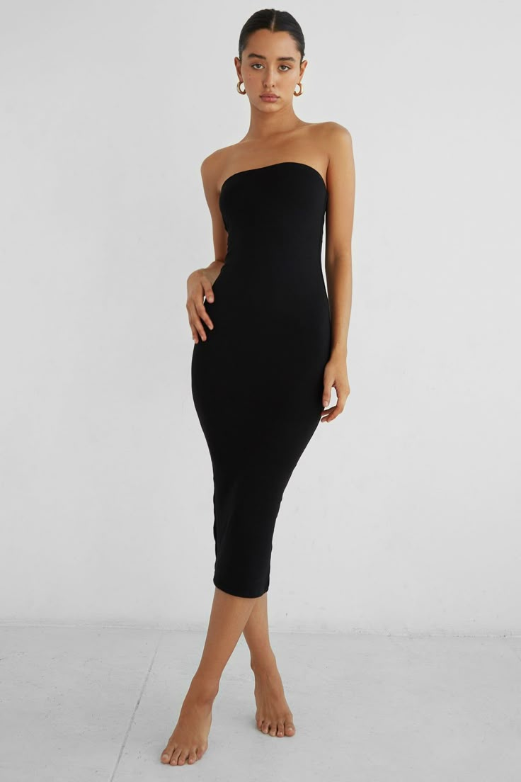 Crafted in our signature double layered modal fabric, this midi-length dress comfortably hugs the body’s curves while producing a strong silhouette. The body-con style is met with a back vent for additional movement and small rubber lining along the inside top seam. Pair with our Bobbi Blazer to complete the look. Strapless Black Dress Midi, Tube Top Black Dress, Black Tube Dress Outfit, Bodycon Photoshoot, Black Dress Layering, Dress With Shirt Underneath, Tube Dress Outfit, Formal Short Dresses, Black Strapless Bodycon Dress