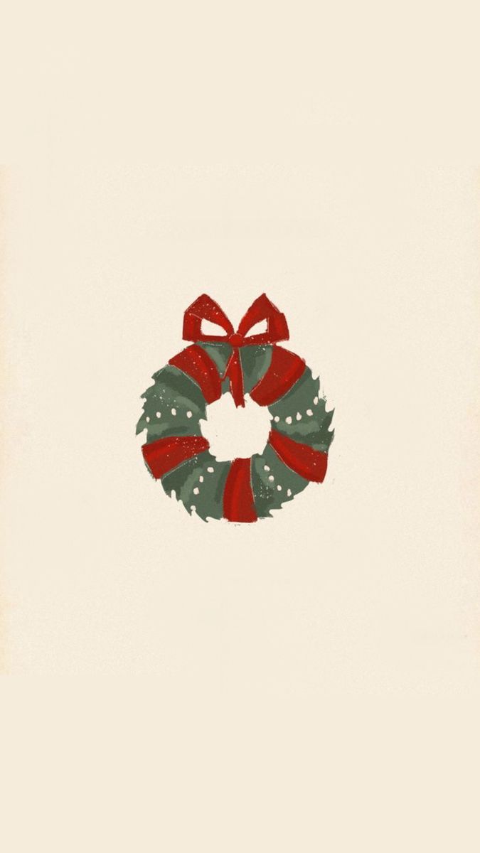 a christmas wreath with red and green ribbons on it's side, in front of a white background