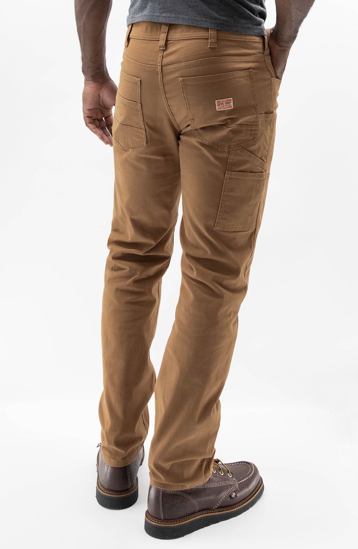 Both durable and soft, these carpenter pants made of breathable cotton sport a touch of stretch and a look that works hard across your casual wardrobe. 16" leg opening; 11" front rise Five-pocket style; tool pockets 98% cotton, 2% spandex Machine wash, tumble dry Imported Brown Straight Leg Chino Bottoms, Brown Straight Leg Cotton Bottoms, Brown Cotton Straight Leg Bottoms, Outdoor Cotton Work Pants With Hip Pockets, Brown Cotton Straight-leg Bottoms, Everyday Brown Bottoms With Pockets, Urban Straight Leg Work Pants With Patch Pockets, Brown Cotton Chinos With Pockets, Outdoor Cotton Work Pants With Side Pockets