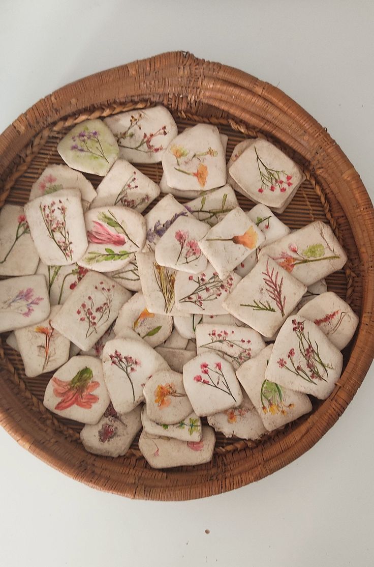 a basket filled with small pieces of cloth