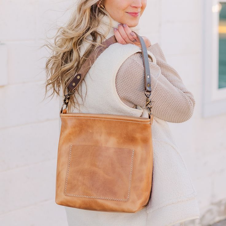 The ultra versatile Kennedy Crossbody bag is going to be your new go-to favorite. The Kennedy comes with a fully adjustable cross body strap as well as a short shoulder strap, giving you the ability to choose how to carry. Made of full grain, Horween leather, this bag features a zippered closure and both interior and exterior pockets. Thoughtfully designed and intentionally crafted, the Kennedy fits all styles with a rustic, yet refined look and feel. Adjustable Leather Bag Strap For On-the-go, Leather Crossbody Bucket Bag For On-the-go, On-the-go Saddle Bag With Leather Handles, Detachable Leather Bag Strap For On-the-go, Everyday Leather Camera Bag With Leather Handles, Everyday Leather-lined Crossbody Bucket Bag, Versatile Leather Bag Strap With Detachable Handle, Leather Camera Bag For Everyday Use, Leather Satchel Bag Strap With Leather Handles