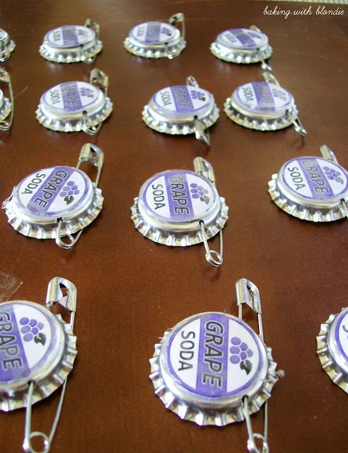 there are many bottle caps that have been made to look like soda bottles with the words grape on them