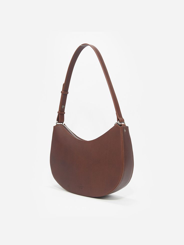 Editor's NotesThe classic design of VACHIMAKER bag creates elegant daily outlook- Rounded silhouette hobo bag - Sophisticated seamless silhouette- Adjustable strap for various styling- Logo-engraved point detail - Soft and durable leather texture- Daily point itemMeasurements(in.)- Size: 11.0in. (W) * 6.7in. (H) * 2.8in. (D)- Strap: 11.8in.Composition & Care- 100% Cow leather- Avoid moisture- Partial clean with a leather cleanerDesigner- by VACHIMAKER Elegant Saddle Bag With Handle Drop For Daily Use, Elegant Everyday Baguette Bag With Leather Handles, Modern Everyday Leather Baguette Bag, Classic Baguette Bag With Leather Handles For Daily Use, Classic Shoulder Bag With Detachable Strap For Daily Use, Elegant Daily Hobo Bag With Removable Pouch, Classic Daily Shoulder Bag With Detachable Strap, Elegant Daily Hobo Shoulder Bag, Elegant Hobo Bag For Daily Use