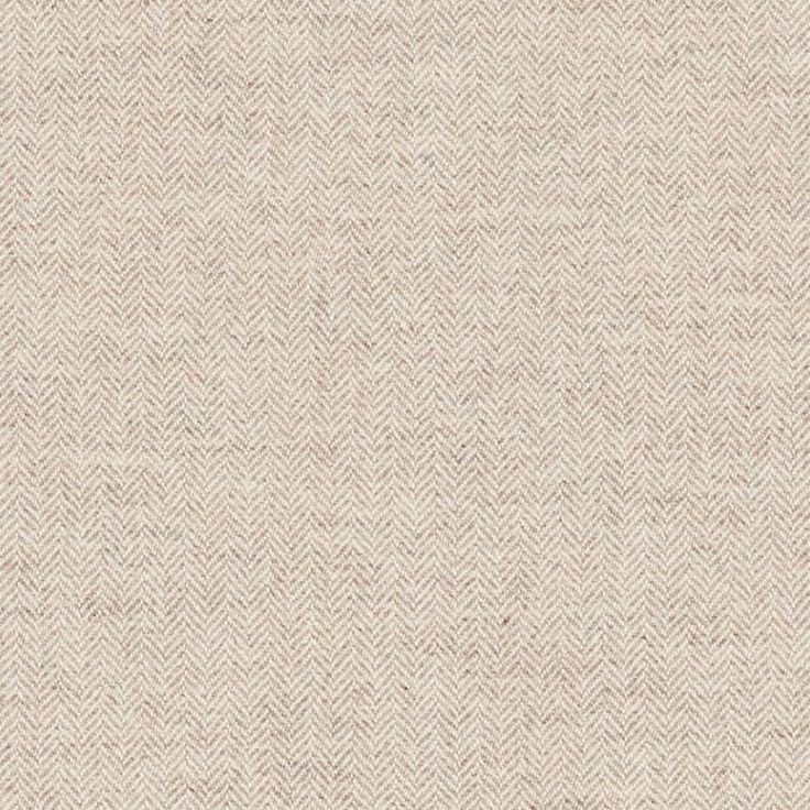 an upholstered beige fabric textured with herringbones