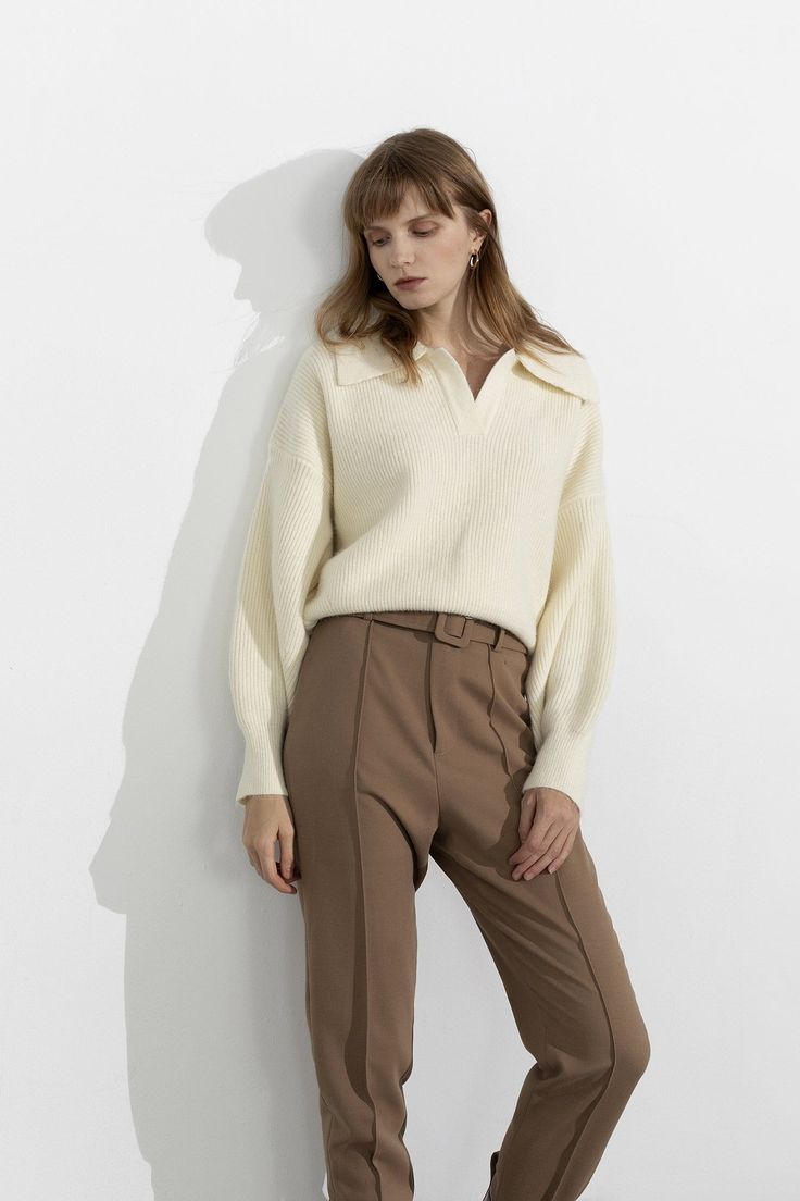 1.Product Details Clean, chic, casual—the three c's for an effortless look. An ivory collared sweater featuring long sleeves and a cropped fit. Pair over minimalist trousers or jeans for a simple yet sophisticated look. Fit Type: Regular Fit How it Fits: Four-way Stretch Fabric: 48%Acrylic 12%Polyamide 4%Spandex 36%Polyester Care Instructions: 1.Hand Wash 2.Do not bleach 3.Dry flat in shade 4.Iron cool (max 110â„? 5.Dry clean, tetrachloroethylene(PCE) only Please note: The images represent actual product though color of the image and product may slightly differ. 2.How To Measure It Model is wearing:S SKU: 2002M0002BGS/MSKU: ${data.sku} White Polo Sweater For Fall, Chic Collared Fall Sweater, Chic Collared Sweater For Fall, White Polo Sweater For Work, Chic White Polo Sweater For Fall, Chic Winter White Cropped Sweater For Fall, Trendy Long Sleeve Cropped Sweater For Work, Cream Polo Sweater For Workwear In Fall, Trendy Cropped Long Sleeve Sweater For Work