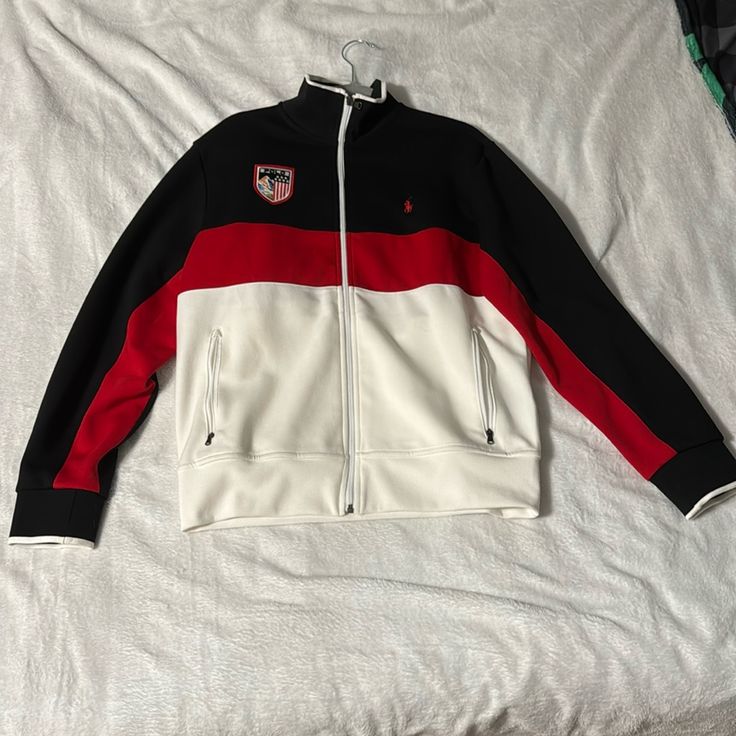 Amazing Condition, Almost Never Worn. Authentic, Vintage, Ralph Lauren Zip Up Sweater. 58% Polyester/42% Cotton. Double Knit Tech-Lsl-Knt. Manufactured 8/17/21 White Casual Track Jacket With Contrast Color, Casual White Track Jacket With Contrast Color, Casual Red Activewear For Sports, Winter Red Tops With Contrast Stripes, Red Tops With Contrast Stripes For Winter, Casual Sports Track Jacket With Contrast Color, Sporty Team-colored Track Jacket For Sports Season, Sporty Track Jacket For Sports Season, Casual Track Jacket With Contrast Stripes For Sports