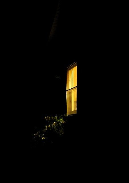 an open window in the dark at night