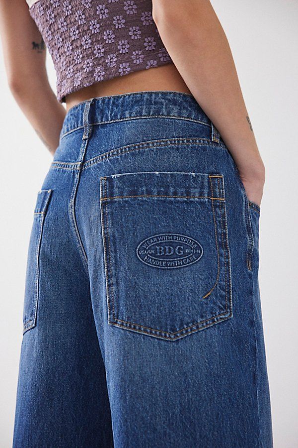 The ultimate pair of effortless boyfriend jeans from BDG. Super relaxed and baggy fit jeans with a low-rise and a wide-leg silhouette. Made in part using recycled materials and finished with a BDG logo at the back pocket. Find the BDG Jaya non-stretch denim jeans exclusively at Urban Outfitters. Features BDG Jaya baggy boyfriend jeans Extreme baggy jeans Crafted from rigid BDG denim Low rise that sits at the hip Full length with a puddled hem Zip fly; 5-pocket styling UO exclusive Content + Care Baggy Cuffed Jeans, Urban Outfitters Outfit Ideas, Outfitters Clothes, Baggy Boyfriend Jeans, Baggy Wide Leg Jeans, Baggy Fit Jeans, Streetwear 2000s, 80s Jeans, Low Rise Baggy Jeans