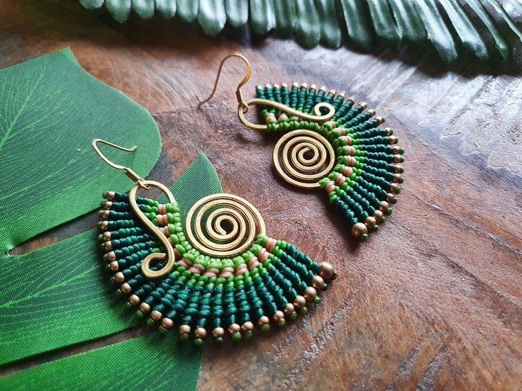 Strikingly bold green macramé earrings, skillfully handwoven round bright gold brass wire, guaranteed to awaken the nature-loving bohemian queen within! For pierced ears, these boho earrings have been lovingly handmade from nickel-free brass wire and waxed cotton which is strong and water-proof. Please do swipe through all the product pictures to get a comprehensive view of the colour and hang of the earrings. Please read the below, in full, prior to purchase. DISPATCH >> Dispatch times ar Green Macrame Jewelry For Festivals, Green Macrame Jewelry For Festival, Green Handmade Bohemian Earrings, Green Bohemian Handmade Earrings, Bohemian Handmade Gold Wrap Earrings, Bohemian Gold Handmade Wrap Earrings, Green Macrame Earrings As A Gift, Green Macrame Earrings For Gift, Green Bohemian Macrame Earrings