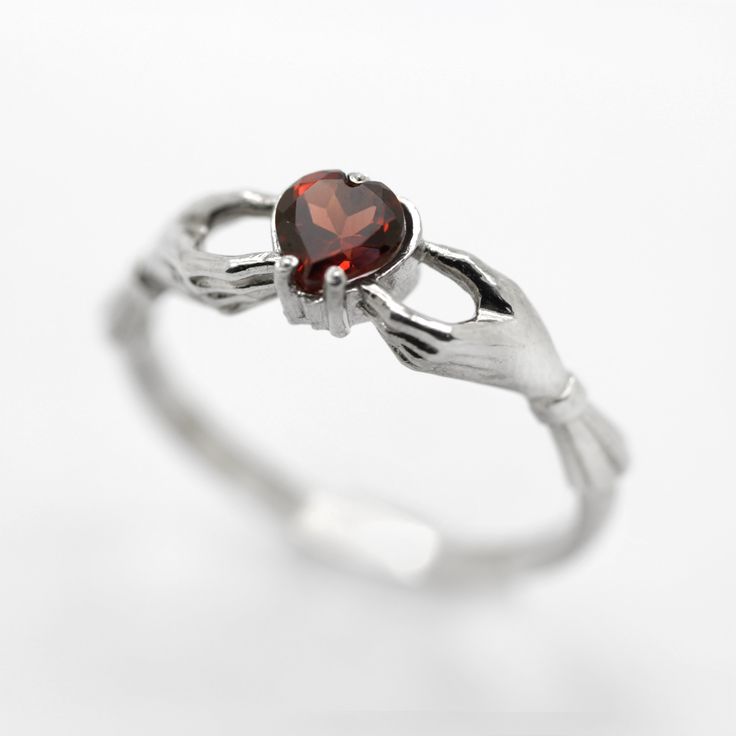 Claddagh Heart Genuine Garnet Sterling Silver Engagement Ring◆ The Claddagh ring has centuries of history, but today it symbolizes three things: friendship, loyalty and love. A beautiful small women ring with black heart zircon on the top. Two skeleton hands hold the black heart from different sides. Perfect fit for engagement or wedding in gothic style occasion. Simple design make it very comfortable and convenient for wearing everyday. We did blacked oxidation on the top and black zircons inse Symbolic Jewelry For Promise On Valentine's Day, Symbolic Promise Jewelry For Valentine's Day, Gothic Heart-shaped Wedding Jewelry, Symbolic Heart Shaped Rings As Gifts, Gothic Rings For Valentine's Day Gift, Gothic Heart-shaped Anniversary Jewelry, Valentine's Day Gothic Rings As Gift, Gothic Sterling Silver Promise Jewelry, Symbolic Heart Ring For Valentine's Day Gift