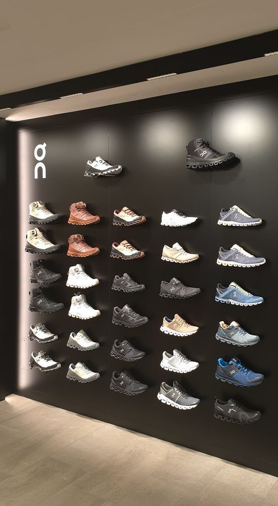 there are many pairs of shoes hanging on the wall