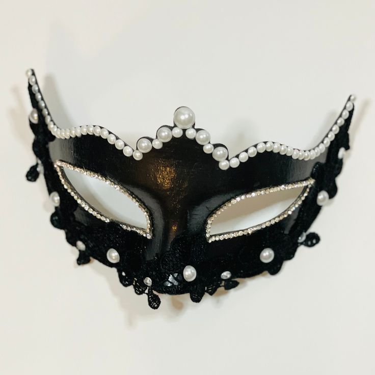 Step into the enchanting world of the Moonlit Masquerade with our exquisitely crafted handmade mask. Each detail is a testament to the artistry and dedication that goes into creating this one-of-a-kind piece, perfect for your next masquerade ball, soirée, or any magical occasion. Crafted from high-quality materials, the mask boasts a durable yet delicate construction. The combination oF schwarophski crystals and lace ensures a luxurious feel against your skin. Handcrafted with precision, the mask features intricate filigree patterns, capturing the essence of timeless craftsmanship. Our masks are designed not only for style but also for comfort. The lightweight design ensures ease of wear throughout your soirée. Elegant Halloween Masquerade Masks And Prosthetics, Fantasy Eye Mask For Masquerade Costume Party, Fantasy Eye Mask For Costume Party, Elegant Evening Eye Mask, Elegant Halloween Eye Mask, Elegant Eye Mask For Halloween, Elegant Halloween Costume Eye Mask, Handmade Costume Accessories For Halloween Masquerade, Carnival Evening Masquerade Eye Mask