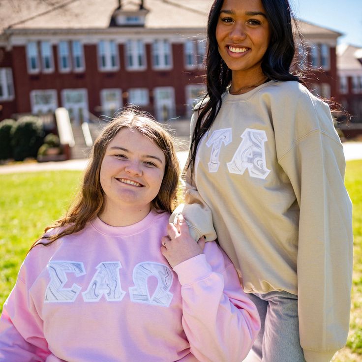 This trendy & unique Silver Glitter Marble Gildan Greek Letter Crewneck Sweatshirt is sure to stand out on any campus! Grab one for you, your big/little, or a group of sisters Picture Details Pictures: ⭑ #1: Sand sweatshirt, White background fabric (Zeta Tau Alpha) & Light Pink sweatshirt, White background fabric (Sigma Alpha Omega) ⭑ #2: Indigo sweatshirt, White background fabric (Alpha Phi) ⭑ #3: Sand sweatshirt, White background fabric (Zeta Tau Alpha) & Light Pink sweatshirt, White backgroun Cute College Tops For Fall, Cute Spring College Tops, Cute Tops For College In Spring, Spring Varsity Top For Campus, Casual Spring Sweatshirt For School, School Crew Neck Sweatshirt, Fall School Sweatshirt, Spring Crew Neck Sweatshirt For School, Spring School Spirit Sweatshirt With Letter Print