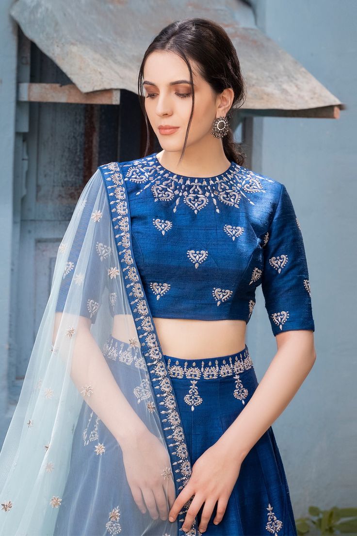 Blue lehenga with embroidered floral motifs. Comes with blouse and sheer dupatta.
Components: 3
Fabric: Raw silk, Net
Neckline: Round
Sleeve Length: Elbow
Color: Blue
Embroidery
Hand embroidery
Embroidered floral motifs on blouse
Embroidered floral motifs on dupatta
Side tassel tie-up detail on lehenga - Aza Fashions Festive Blue Sharara With Intricate Embroidery, Blue Anarkali Lehenga With Intricate Embroidery, Semi-stitched Royal Blue Blouse Piece For Wedding, Blue Floor-length Embroidered Designer Fabric, Festive Blue Sets With Intricate Embroidery, Blue Embroidered Anarkali Fabric For Festive, Blue Anarkali Set With Intricate Embroidery For Reception, Royal Blue Resham Embroidery Fitted Choli, Blue Anarkali-style Embroidered Fabric For Festive Occasions