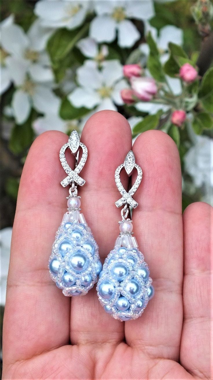 Discover the perfect blend of sophistication and grace with our stunning Droplet Earrings, meticulously handcrafted to captivate hearts and turn heads. These alluring earrings are the epitome of timeless beauty, designed to elevate your style and leave a lasting impression on any occasion. You get the droplet earrings in a gift box. Droplet earrings sizes: Length: 5 cm / 1.97 inches Drop length: 3 cm / 1.18 inches Width: 1.5cm / 0.59 inches To keep the beaded earrings as long as possible I recom Elegant Pear-shaped Cluster Earrings For Formal Occasions, Elegant Pear-shaped Earrings For Evening, Elegant Round Clip-on Cluster Earrings, Elegant Round Cluster Clip-on Earrings, Elegant Teardrop Cluster Earrings For Formal Occasions, Elegant Pear-shaped Chandelier Earrings, Handmade Elegant Teardrop Earrings, Elegant Handmade Teardrop Pearl Earrings, Handmade Elegant Teardrop Earrings For Anniversary