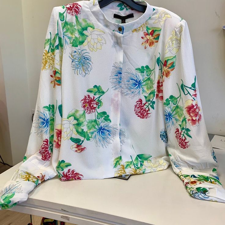 *Brand New* Max Sport Floral White Bomber Blouse Brass Hardware Button Detail Built-In Shoulder Pads Discrete Zipper On Sleeves For A Cinched Look Size M [Runs True To Size] Perfect Condition / Brand New W/ Tags Cute And Trendy! Sure To Get Compliments :) Closet Policies: I Consider All Reasonable Offers Bundle And Save 10% My Goal Is To Ship The Next Business Day If You Have Questions Please Ask! Student Discounts Available Chic White Shirt With Floral Print, Daywear Button-up Blouse With Floral Print, White Blouse With Button Closure For Spring, Multicolor Office Shirt For Spring, Spring Multicolor Office Shirt, Spring Office Multicolor Shirt, White Button-up Blouse For Spring, White Floral Print Office Blouse, Spring Daywear Blouse With Button Closure