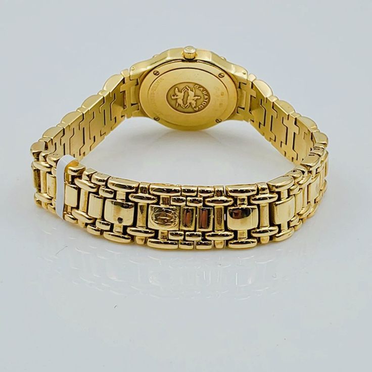 Women's Concord Sarento 24mm Solid 18K Yellow Gold Band Watch, with Roman Numeral Gold Dial, and Diamond Bezel. Includes Mahogany Box. Brand: Concord. Case Back: Solid. Gender: Women's. Condition: Pre-Owned. Dial Color: Yellow Gold. Case Dimensions: 24mm. Bracelet / Strap: Solid Gold. Bracelet Size: 5.3/4 (inches). Bezel Color: 18K Yellow Gold. Condition: Excellent Condition. Movement: Quartz (Movement). Metal Type: 18K Gold Solid Gold. Warranty: 1 Year Limited Warranty. Gold Watch Accessories With Polished Finish For Formal Occasions, Gold Business Watch With Bracelet Strap, Yellow Gold Watch Bracelet Strap, Yellow Gold Round Watch Accessories With Polished Finish, Yellow Gold Polished Finish Round Watch Accessories, Yellow Gold Watch Bands With Polished Finish For Anniversary, Yellow Gold Watch Accessories With Polished Finish For Anniversary, Timeless Gold Jewelry And Watches With Round Shape, Yellow Gold Polished Watch Accessories For Anniversary