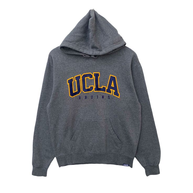 "PLEASE READ DESCRIPTIONS BEFORE BUYING. Contact me for questions about this cloth UCLA Hoodie University Of California Sweatshirt Sweater Pullover Jumper Long Sleeve Medium Size Dark Gray Colour Los Angeles College Bruins TAG BRAND:- UCLA SIZE ON TAG :- S. Fit to Medium according measurements ACTUAL SIZE MEASUREMENT :- ARM PIT TO ARM PIT :21.5\" inches BACK COLLAR TO HEM : 26\" inches SLEEVE LENGTH : 24.5\" inches CONDITION :- Good used condition. No hole No stain Please refer the pictures. Ple Varsity Fan Gear Hoodie Top, Varsity Hoodie Fan Gear Top, Collegiate Crew Neck Top With Drawstring Hood, Winter Fan Apparel Hoodie In Athletic Heather, Varsity Hoodie With Letter Print, Long Sleeve, Varsity Hoodie With Letter Print, Varsity Long Sleeve Hoodie With Letter Print, Winter College Sweatshirt With Letter Print, College Cotton Hoodie Sweater