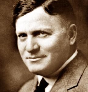 an old black and white photo of a man in a suit