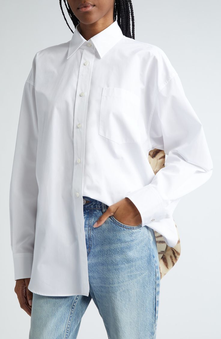 Simple and versatile, this cotton button-up shirt is kept comfortable in a billowy, oversized fit with dropped shoulders and a chest pocket. 31" length (size 34IT) Front button closure Point collar Long sleeves with button cuffs Dropped shoulders Chest patch pocket 100% cotton Dry clean Imported Designer Clothing White Button Up, Oversized Fits, Stella Mccartney, Patch Pocket, Clothing Items, Looks Great, Button Up Shirts, Designer Clothing, Button Up