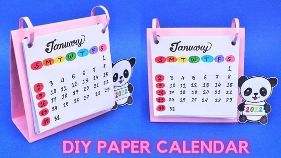 two pink calendars with panda bears on them