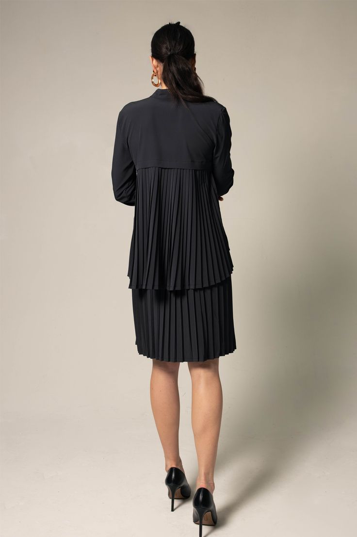 Black pleated shirt is versatile and perfect for the all-season. Blends into every work environment and is made for all kinds of season! . Color: Black. Length: 29 inches. Made in America. Care: Dry Clean. Composition: 88% polyester, 12% spandex. Sizing: • Fits true to size • Designed for a regular fit • Mid-weight, non-stretchy fabric • Model is 5ft 11in/ 180.34 cm, and wears a size Small (2) Pleated Shirt, Pleated Blouse, Work Environment, Made In America, Stretchy Fabric, In America, Black Shirt, Cold Shoulder Dress, Composition