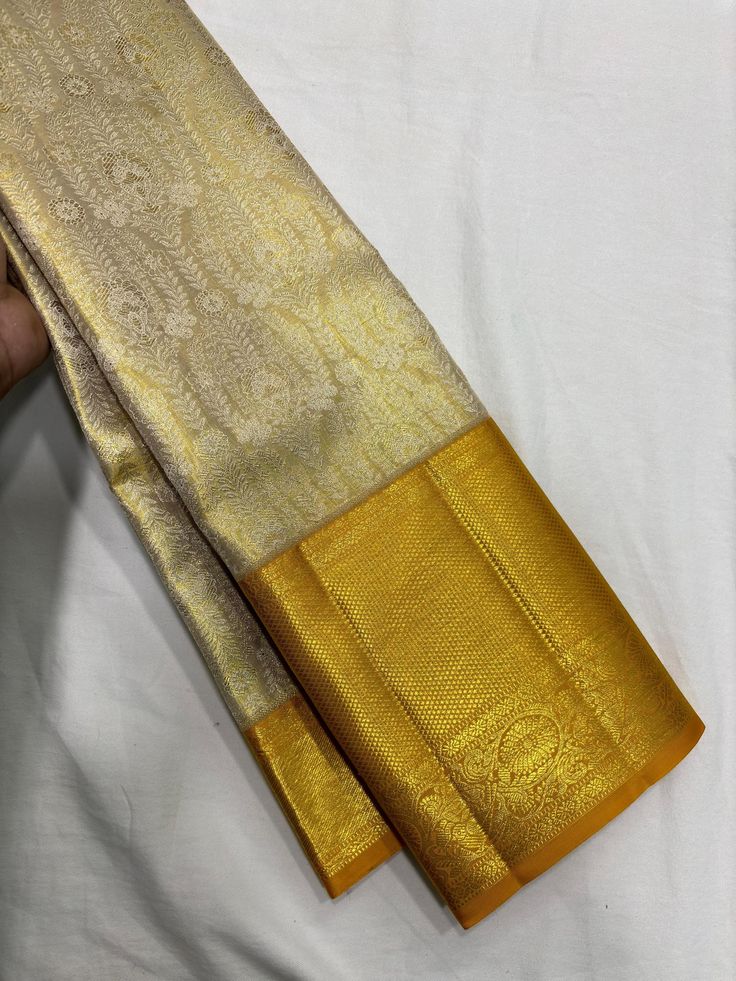 Bridal Collection Beige Color Pure Kanchipuram Silk Saree | Indian Traditional Ethnic Saree | Wedding or Party Wear Saree | Handwoven Gift Saree for Her Product Details : Saree Type : Pure Kanchipuram Silk Saree Golden Zari, Silk Mark Certified Blouse Piece : Yes (Un-Stitched) Saree Length : 5.5 Meters Blouse Piece Length : 80 cm Saree Weight : 0.9 kg Saree Fabric : Pure Kanchipuram Silk  Color : As shown in the picture Work : weaving Pattern : designer Occasion: Party Wear, Formal Wear, Festiva Gold Pre-draped Saree With Traditional Patterns For Festivals, Gold Brocade Pre-draped Saree With Zari Weaving, Semi-stitched Gold Anarkali Set With Motifs, Gold Brocade Pre-draped Saree With Zari Work, Gold Chandbali Pre-draped Saree For Diwali, Diwali Gold Pre-draped Chandbali Saree, Traditional Gold Tissue Silk Choli, Gold Traditional Wear With Cutdana For Transitional Season, Gold Pre-draped Saree With Zari Work For Weddings