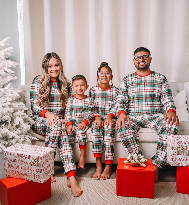 It isn't the Holidays without matching pajamas. Snag your family set before they're gone!  I T E M D E S C R I P T I O N  *  Comfy Pajamas (Price listed includes 1 pants and 1 long-sleeved ) *  Material: 95% Polyester / 5% Spandex *  Elastic Waistband  If you're looking for matching shoes, you can find them in our site! Here: https://littlemiabella.com/collections/shoes S I Z I N G  Women S: Top: Length: 23.2" | Chest: 36.2" | Sleeve Length: 22" Bottom:  Length: 41.3"| waist: 28.4" Gross Elastic Family Of 3 Christmas Pajamas, Christmas Family Dinner Outfits, Family Matching Holiday Sleepwear, Family Matching Holiday Festive Sleepwear, Christmas Pj Photoshoot Family, Family Pajamas Christmas Photo Ideas, Family Christmas Pajamas Photoshoot, Neutral Christmas Photos Family, Christmas Pajamas Photoshoot