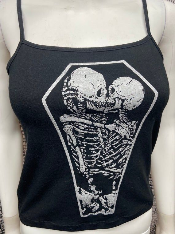 This is a black sleeveless Skeletons in a coffin cropped tank top.This has a Coffin image screen printed on the front in silver ink. 57% cotton/ 38% polyester/ 5% SpandexThese are handmade screenprinted and slightly vary from the photo. Please feel free to email me any questions. Thanks for looking. Goth Fits, Skeleton Couple, Summer Goth, Black Cropped Tank, Black Crop Top Tank, Diy Clothes Life Hacks, Bodysuit Fashion, Goth Outfits, Black Sleeveless