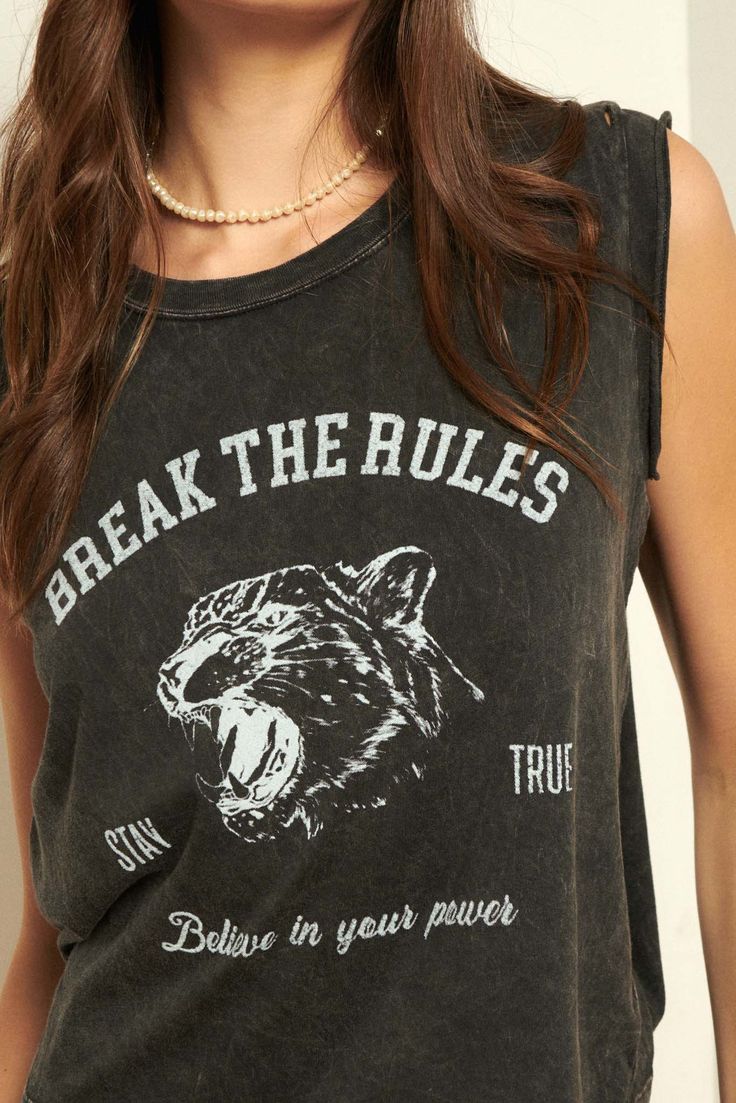 A mineral washed graphic tee with the following features: Vintage-style leopard graphic print with text that reads: "Break the Rules," "Stay True," and "Believe in Your Power". Cut-off sleeves with raw edge. Round neckline. Distressed detailing at neckline and hem. Relaxed fit. 100% Cotton. Imported top designed and printed in LA. Model wears size S. Trendy Graphic Print Crew Neck Tank Top, Edgy Sleeveless Graphic T-shirt, Edgy Sleeveless Graphic Print T-shirt, Grunge Crew Neck Tank Top With Letter Print, Sleeveless Grunge T-shirt With Letter Print, Rebellious Cotton T-shirt With Graphic Print, Rebellious Cotton Top With Graphic Print, Rebellious Cotton Tops With Graphic Print, Rebellious Cotton Graphic Print Tops