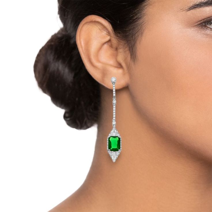 Dazzling with green and white cubic zirconia gemstones, these sterling silver drop earrings lend an elegant touch to your wardrobe. Dazzling with green and white cubic zirconia gemstones, these sterling silver drop earrings lend an elegant touch to your wardrobe. Metal: sterling silver Backings: post Packaging: boxed Finish: polished Length: 57 mmSTONE DETAILS Stone type: green & white cubic zirconia Total weight: 3 ct. Shape: baguette cut, round Gemstones may have been treated to enhance their appearance. Special care may be required. Please visit our Gemstone Treatment & Special Care Guide for more information. Please note, due to the high value of this item, a signature may be required upon delivery. Size: One Size. Gender: female. Age Group: adult. Green Diamond Dangle Earrings For Formal Occasions, Classic Green Diamond Drop Earrings, Green Dangle Diamond Earrings For Formal Occasions, Classic Green Diamond Earrings, Green Diamond Earrings For Parties, Green Diamond Drop Earrings, Elegant Green Diamond Earrings, Green Diamond Drop Earrings For Party, Green Diamond Earrings With Prong Setting