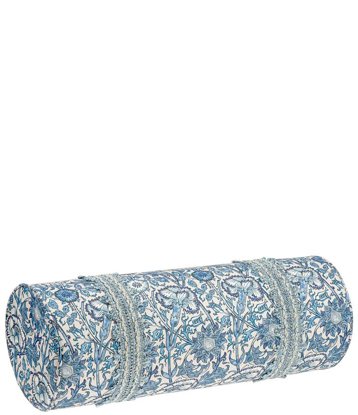 a rolled up yoga mat with blue and white designs