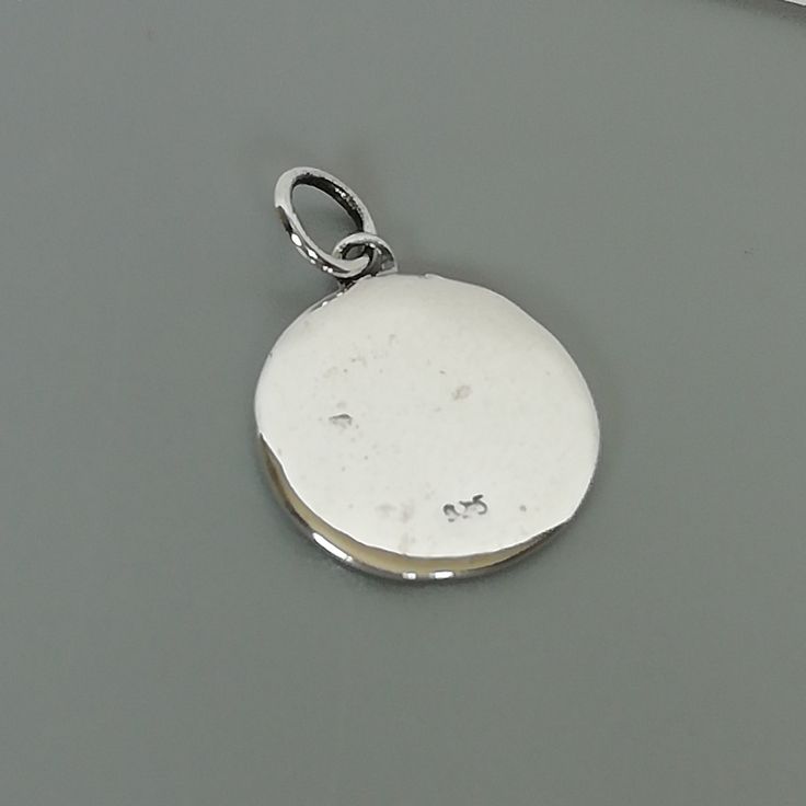 ▪︎ ONE sterling silver round charm with LOVE YOU inscribed on it. ▪︎ Size: 13 x 15 mm ( 17mm with hoop) Weight: 1.3 gm ▪︎ This is a multi functional charm and can be used with neck chains, ear hoops, bracelets, anklets, key chains etc. ▪︎ This pendant is handmade with hypoallergenic sterling silver, and is nickel free. Comes with a 925 mark for authenticity. ▪︎ Please note: Price listed is for ONE charm. This pendant comes WITHOUT the chain, however, you can add a snake neck chain, bracelet chai White Gold Pendant Charms For Anniversary, Silver Round Pendant Spiritual Charm, Personalized White Sterling Silver Charms, Symbolic Hallmarked Pendant Charms, Symbolic Silver Round Pendant Charms, Silver Engraved Round Pendant Charms, Sterling Silver Engraved Spiritual Charms, Silver Symbolic Round Pendant Charms, Silver Round Pendant Charms For Anniversary